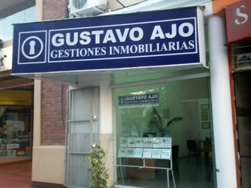 GUSTAVO AJO Gestiones Inmobiliarias logo