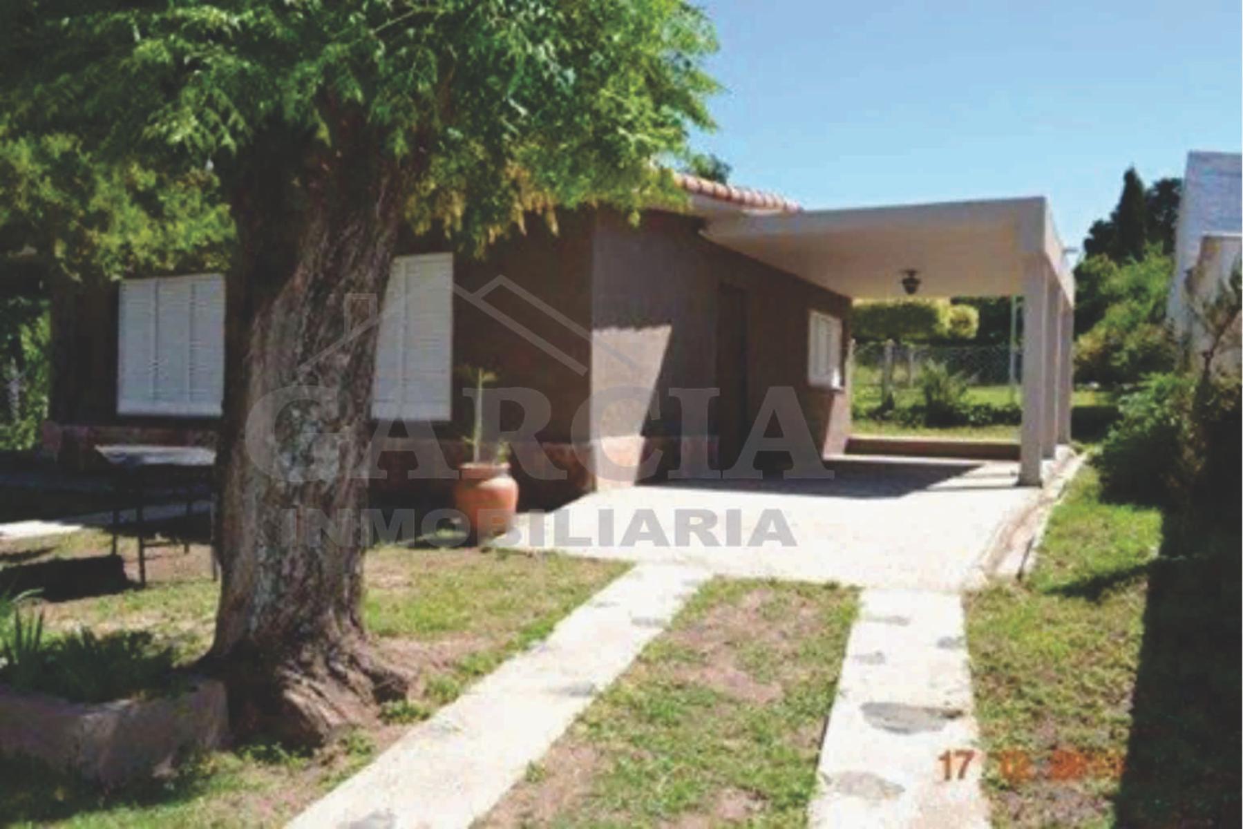 CASITA FRENTE AL RIO, san antonio de arredondo, CORDOBA, CON 2 DORMITORIOS, cocina-comedor, baño, cochera, quincho con lavadero y patio.